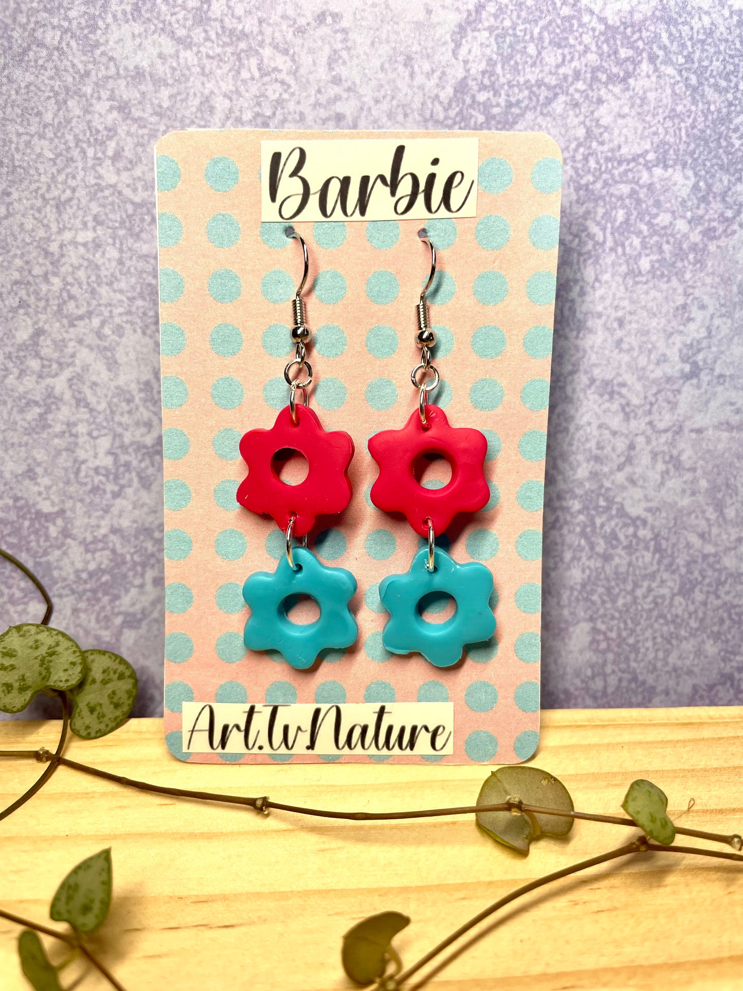 Barbie inspired pink and blue flower earrings on a spot backing card