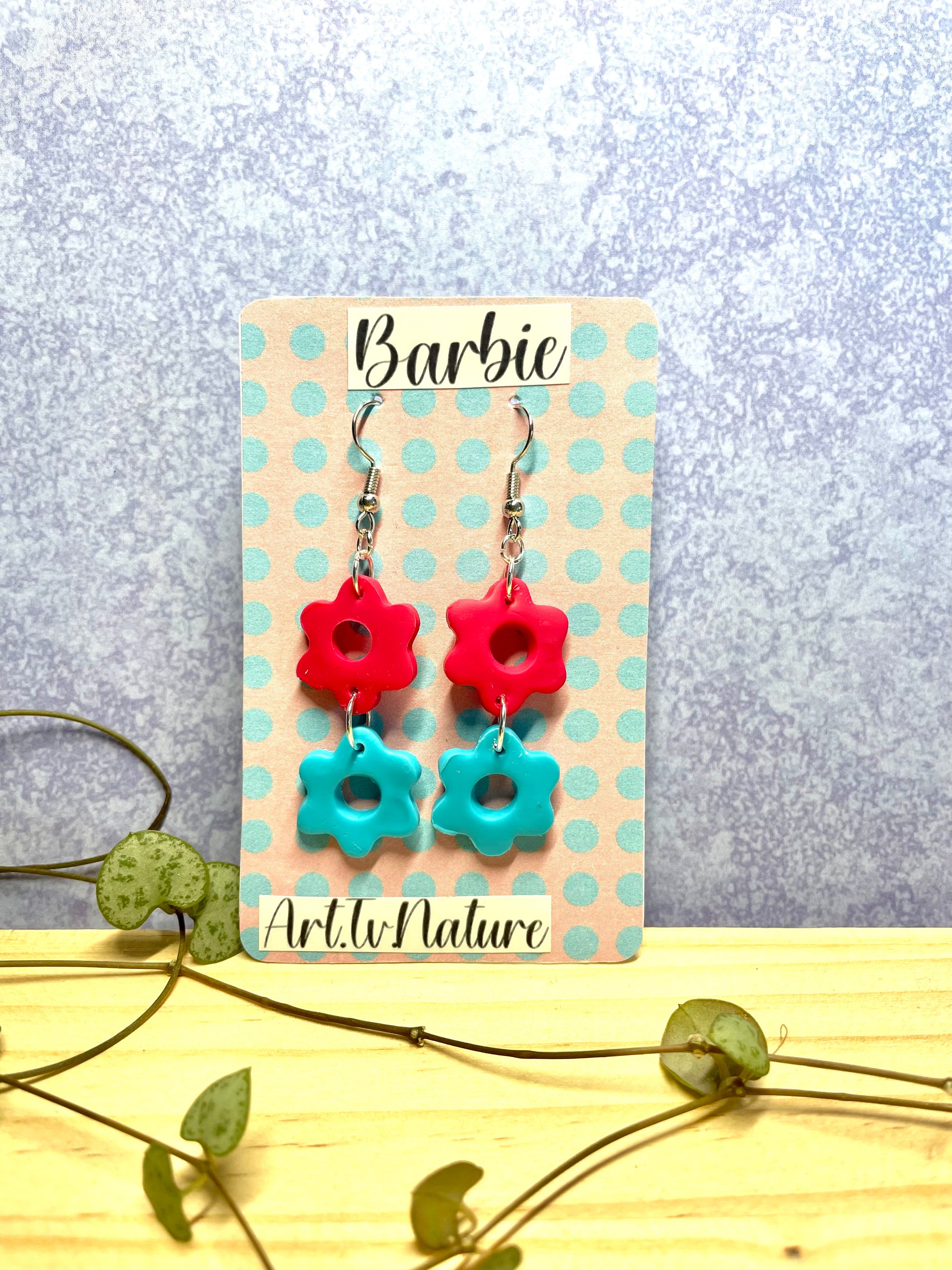 Barbie inspired pink and blue flower earrings on a spot backing card